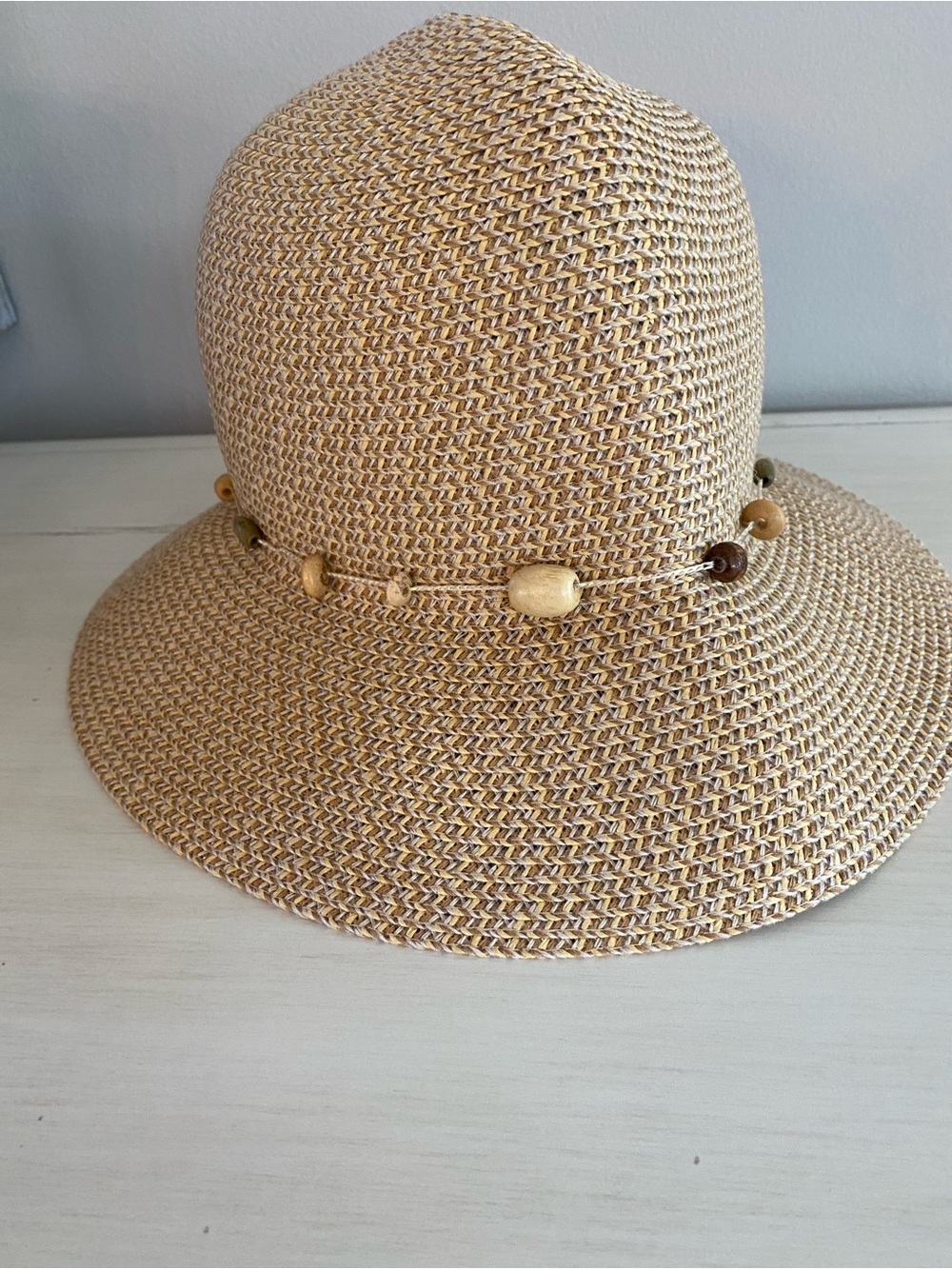 Wallaroo Naomi women’s beaded bucket hat made from natural woven fibers.  UPF 50